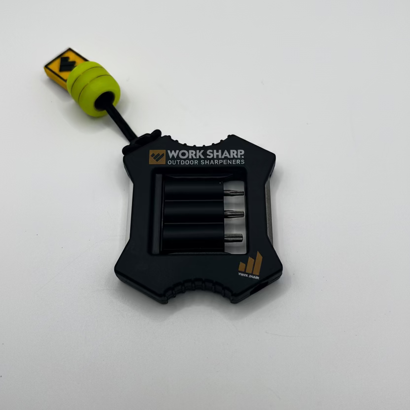 A black Work Sharp outdoor sharpeners solar battery pack with a bright yellow-green connector, shown on a plain white background.
